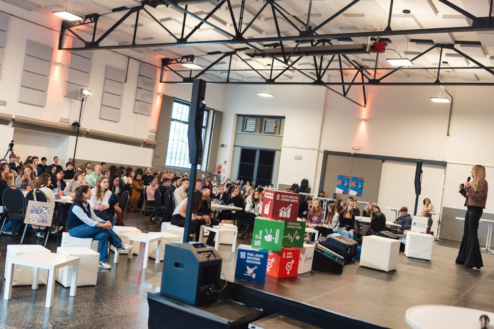 The audience at the Seifenfabrik in Graz during Odeta's talk at the EYI Festival 2025.