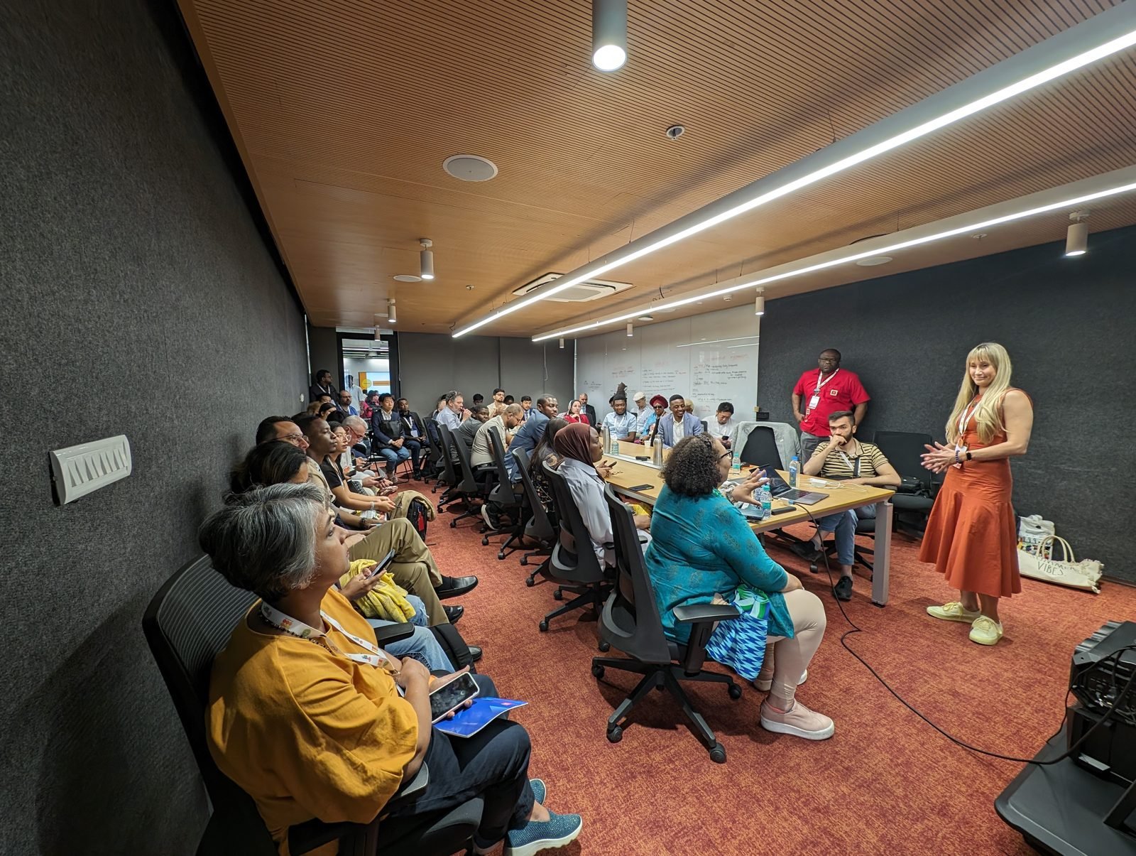Odeta speaking to participants seated along a long table during a session at the WSA Global Congress 2025 in Hyderabad.